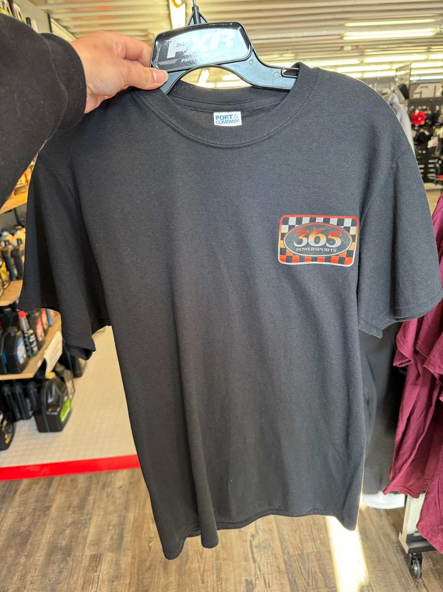 365 Checkered Block T-Shirt with checkered logo design displayed on hanger.