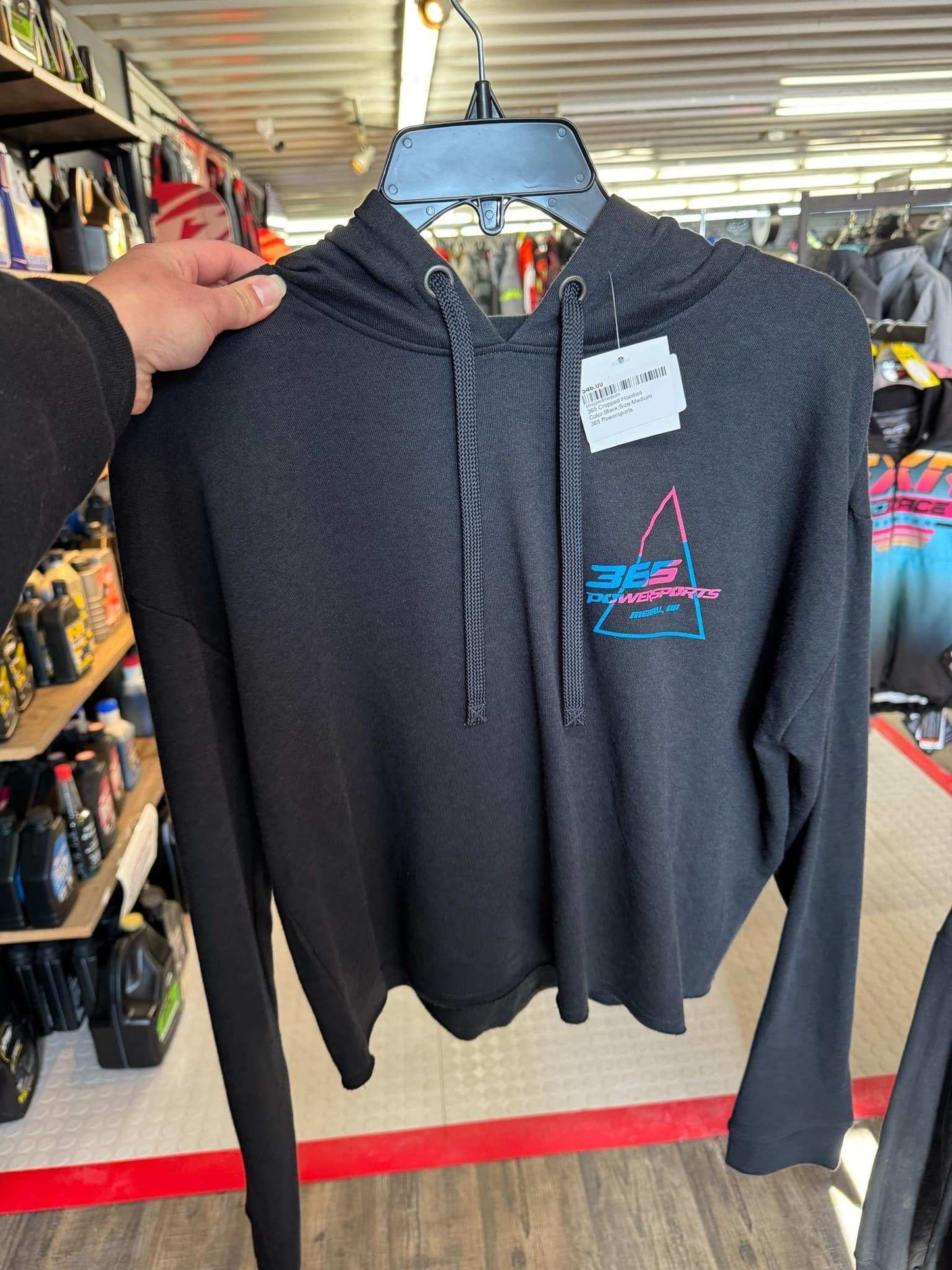 Black 365 Cropped Hoodie on display in store.