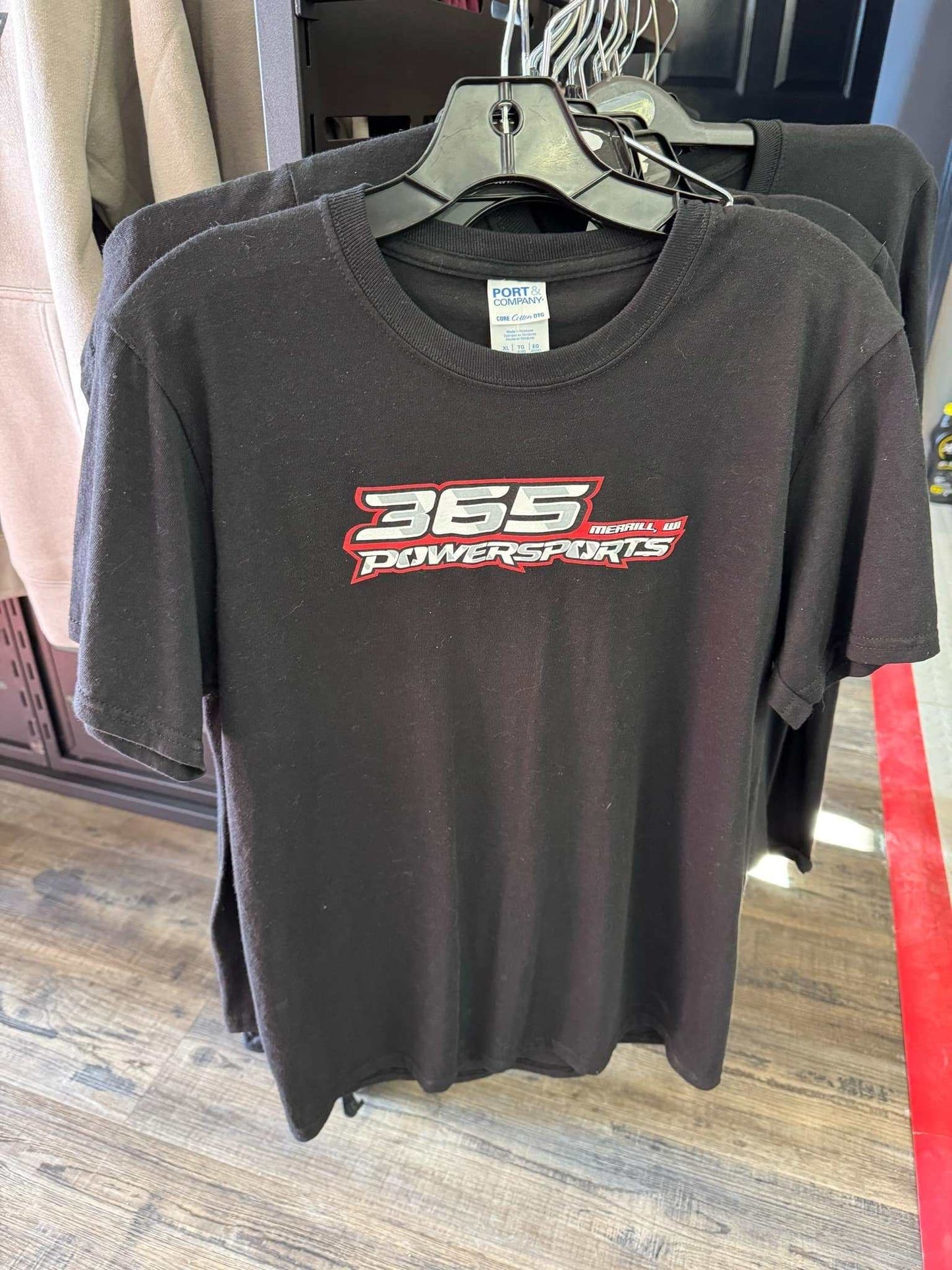 Black 365 Youth TShirt on hanger with red and white logo.