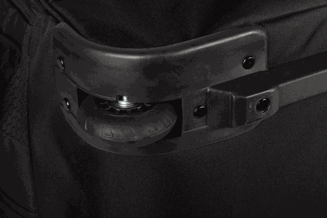Wheel detail of the KLIM Team Gear Bag with rugged construction and easy transport design.