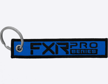 FXR Flight Tag blue key chain with black lettering and metal ring
