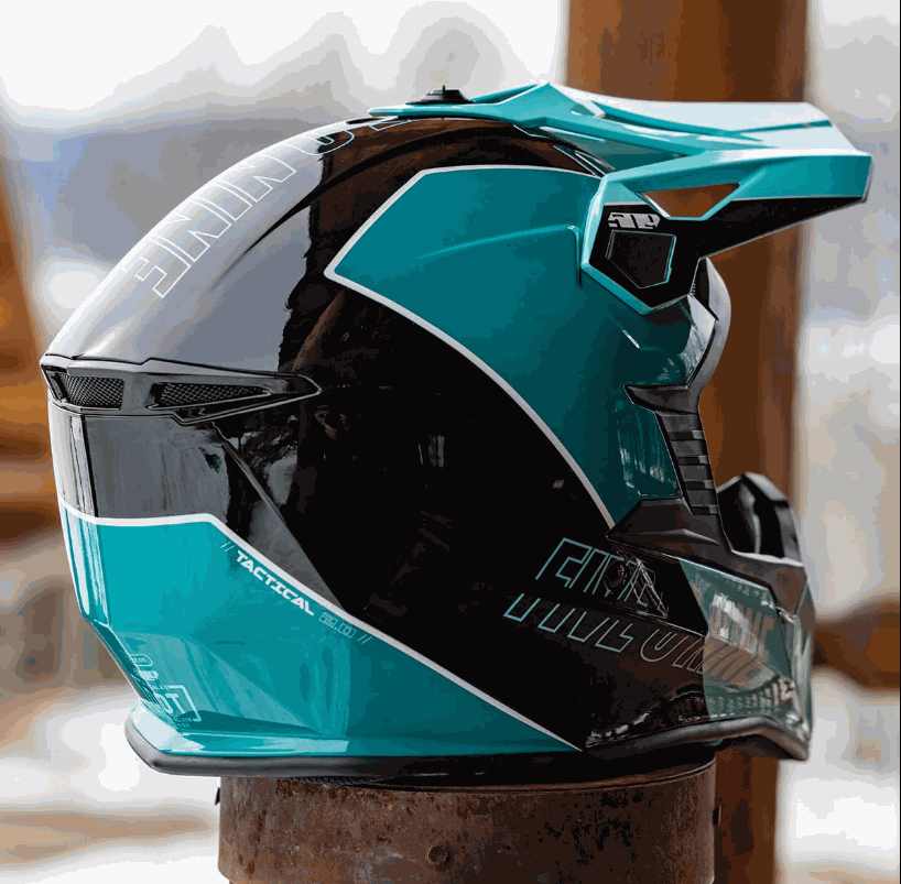 509 Tactical 2.0 Helmet in teal and black with aerodynamic design and integrated eyeport protection